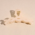 Detail of matte cream claw clip with textured twist handle and gold metal spring - Matte Cream