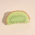 Detailed close-up of a kiwi-shaped hair claw clip with vibrant green acrylic textures - Kiwi Fruit Hair Claw