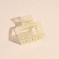 Detail of a translucent cream yellow square hair claw clip with a durable metal spring - Champagne