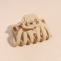 Detailed top view of a matte nude resin hair claw clip with sturdy metal spring - Khaki