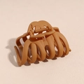 Detail view of large matte ginger hair claw clip showing strong cross-teeth design - Coffee