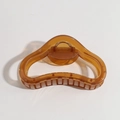 Translucent brown acetate hair claw clip with golden spring on a white background - Irregular Oval Brown