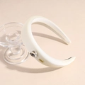 Close-up of white padded headband with crystal heart and gold metal LOVEDAYS logo tag - White
