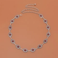 Detail view of retro silver metal waist chain with red stones and lobster clasp closure - Red