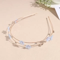 Detail of double-layer gold headband with blue fabric flowers and faux pearls - Blue