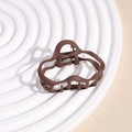 Detail of matte dark coffee wavy hair claw clip on white decorative rippled tray - Cloud Deep Coffee