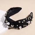 Dettaglio di un cerchietto nero con nodo, decorato con perle bianche e cristalli - Nero