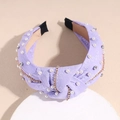 Cerchietto viola in tessuto con nodo elegante, perle finte e catena dorata decorativa - Viola