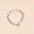 Detail of elegant pearl hair tie with gold textured bead and smooth round pearls - Gold Beaded Pearl Hair Tie Bracelet