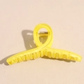 Macro detail of 13cm candy yellow translucent resin hair claw with sturdy metal spring - Large / Yellow