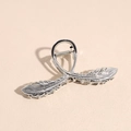 Detailed close-up of a silver feather hair claw clip with metallic texture and spring mechanism - Bright Silver Feather Style / Feather Claw Clip