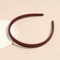Close-up of matte dark red headband showing herringbone texture and non-slip inner teeth - Burgundy