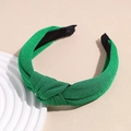 Detail of bright green knotted headband with shimmering texture and non-slip lining - Dark Green
