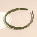 Close-up of olive green matte wavy headband featuring internal non-slip teeth for secure grip - Green