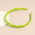 Detail view of neon green wavy headband featuring anti-slip inner teeth for secure grip - Neon Green