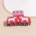 Detalle de pinza de pelo roja de acrílico con motivos pixelados de renos y pinos - Reno Rojo