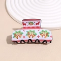 Detail of Christmas claw clip with reindeer and bell prints on cream acrylic material - Bell