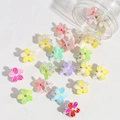 Mini flower hair clips in colorful candy tones scattered from a clear plastic jar - Flower Shape / 20 Pieces Set