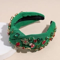 Détail du bandeau de Noël avec strass, flocons de neige en métal et design festif noué - Vert