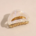 Macro view of French vintage shark clip with pearlescent acetate shell and metal teeth - Pearlescent Beige