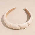 Detail of cream twisted PU leather headband with non-slip velvet lining and soft texture - Beige