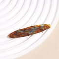 Detailed macro view of leopard print hair clip featuring France Handmade gold engraving - Tortoise