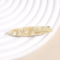 Close-up of leopard pattern hair clip with gold France Handmade engraving detail - Beige