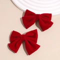 Detail of red velvet bow hair clips featuring soft fabric and vintage aesthetic style - Large Velvet Bowknot Red