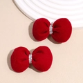 Detail of red velvet bow hair clips with white pearl bead center and elegant texture - Pearl Bowknot Red