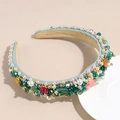 Detail of baroque headband featuring emerald crystals, faux pearls and colorful beads - Green
