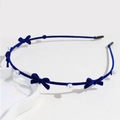 Navy blue velvet headband featuring small bows and white pearls on thin band - Navy Blue