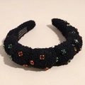 Dettaglio di cerchietto in peluche nero con strass di lusso e etichetta fatta a mano - Nero
