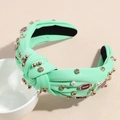 Detail of mint green knotted headband with pearls, rhinestones and football charms - Mint Green