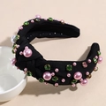 Close-up of black knot headband with pink pearls and colorful rhinestones in claw settings - Black
