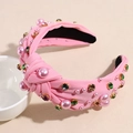 Detail showing pink knotted headband with sewn pearls and colorful rhinestones - Rose Red
