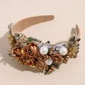 Macro shot of baroque headband with satin roses, pearls, and rhinestones - Champagne