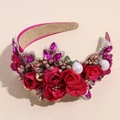 Detailed macro view of baroque headband featuring red fabric roses and rhinestones - Rose Red
