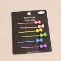 Set of six matte bow hair clips in vibrant rainbow colors on a display card - Small Bowknot Style