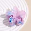Close-up of marble pattern flower hair claw clip with pink blue and purple swirls - Gradient Purple