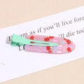 Detail of pink jelly cherry hair clip with mint green matte metal duckbill clip design - Cherry Green