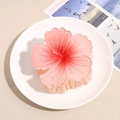 Detailed view of pink frangipani flower hair claw clip with realistic petal texture - Red Pink