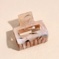 Close-up of rectangular cream hair claw clip with black ink splatter marble pattern - 4cm Light Brown Square Claw