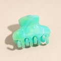 Detailed close-up of marble pattern plastic hair claw clip with mint green fluid texture - 4.5cm Teal Solid Semicircle Claw