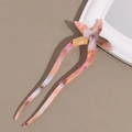 Detail of starfish acetate hair fork with pink marble texture and embedded rhinestone - Yellow Pink Gray