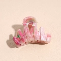 Close-up of pink marble texture hair claw clip with silver metal spring for styling - 4.5cm Pink Green Wavy Claw