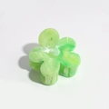 Detailed top view of a green and white marble floral plastic hair claw with spring design - 4cm Pure Green Flower Claw