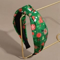 Detailopname van groene kerst hoofdband met rendier- en sneeuwvlokpatronen in close-up - Groene Eland
