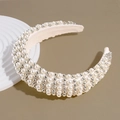 Detailed close-up of handmade baroque padded headband with white pearls and silver beads - White