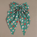Vue détaillée du grand nœud papillon de Noël avec motifs de bonhomme de pain d'épices - Vert