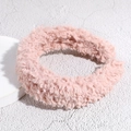 Close-up of plush pink faux lamb wool headband with thick soft texture and wide frame - Pink
